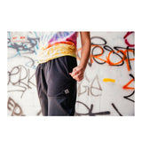 Hearthstone POINT3 DRYV Black Joggers - Standing Model in Front of Graffiti Wall View